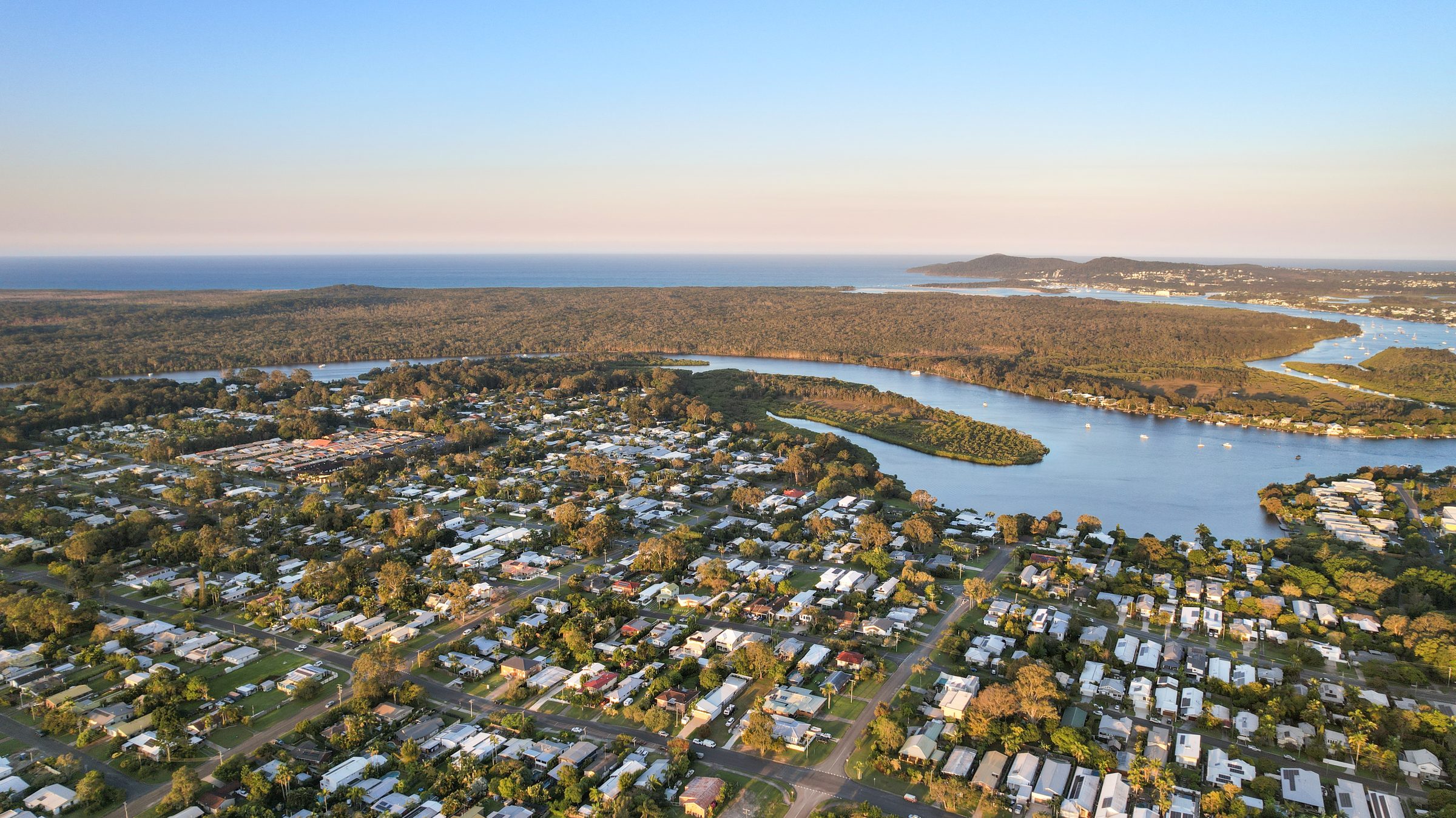 Aerial closer to the property at dusk